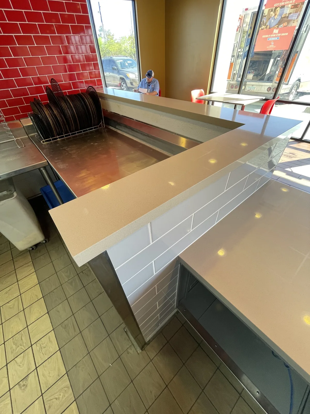 Finished commercial counter installation with clean tile detailing