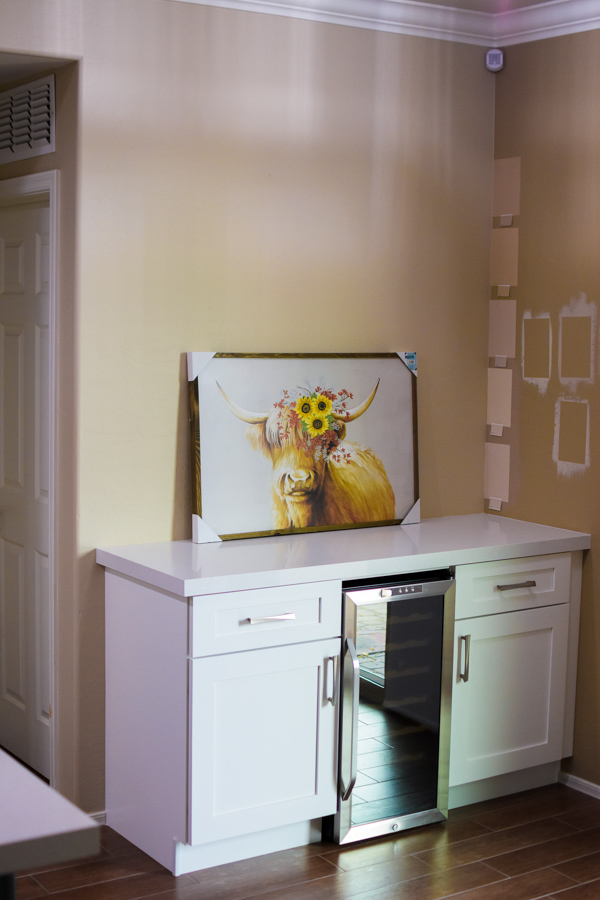 Finished kitchen with custom cabinetry, quartz counters, and integrated appliances