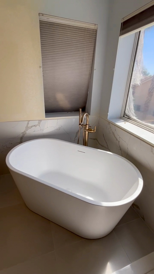 Bathroom tile flooring with clean lines and finishing details