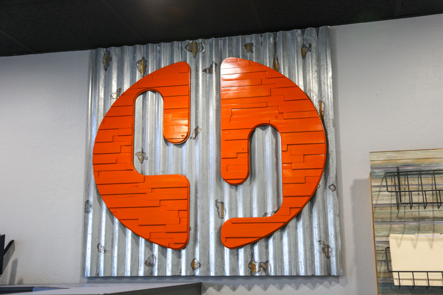 Orange Cactus Remodeling logo wall at our Chandler showroom